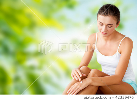 beautiful woman applying hand cream beautiful woman applying hand cream 42339476