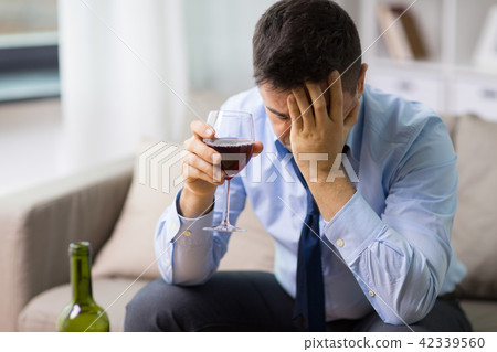 alcoholic drinking red wine at home alcoholic drinking red wine at home 42339560