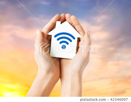 hands holding house with radio wave signal icon hands holding house with radio wave signal icon 42340097