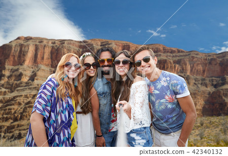 friends taking selfie by monopod at grand canyon friends taking selfie by monopod at grand canyon 42340132