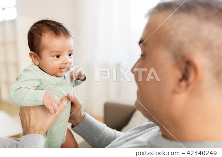 happy father with little baby boy at home 42340249