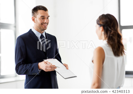 realtor showing contract document to customer 42340313