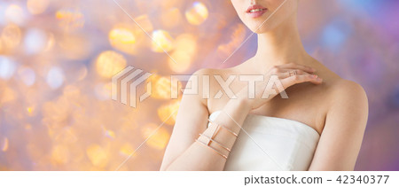 close up of beautiful woman with ring and bracelet close up of beautiful woman with ring and bracelet 42340377