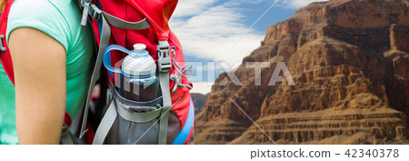 close up of woman with water bottle in backpack close up of woman with water bottle in backpack 42340378