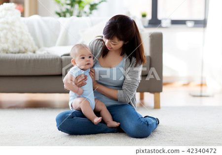 happy young mother with little baby at home happy young mother with little baby at home 42340472