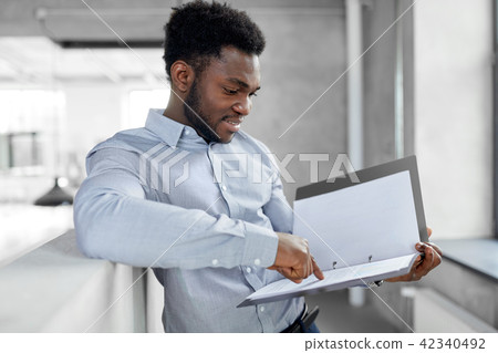 african american businessman with folder at office 42340492
