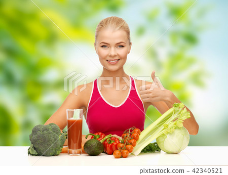 woman with vegetables and juice showing thumbs up woman with vegetables and juice showing thumbs up 42340521