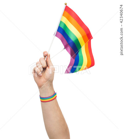 hand with gay pride rainbow flags and wristband 42340674