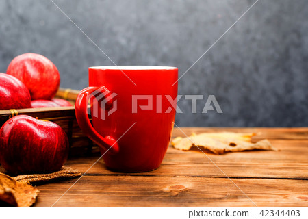 Fall harvest cornucopia. Cup of Hot apple tea Fall harvest cornucopia. Cup of Hot apple tea 42344403