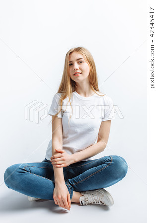 Young girl posing and smiling Young girl posing and smiling 42345417