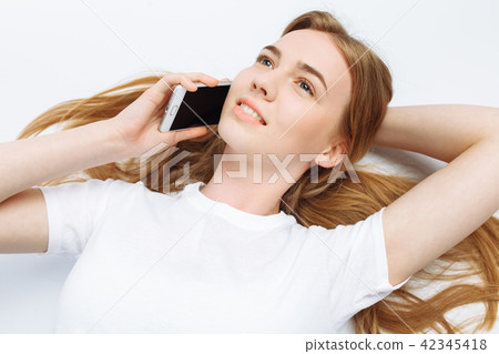 Beautiful young girl talking on the phone Beautiful young girl talking on the phone 42345418