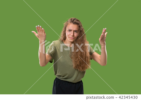 Beautiful female half-length portrait isolated on green studio backgroud. The young emotional Beautiful female half-length portrait isolated on green studio backgroud. The young emotional 42345430