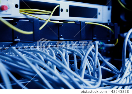 Network panel, switch and cable in data center 42345828