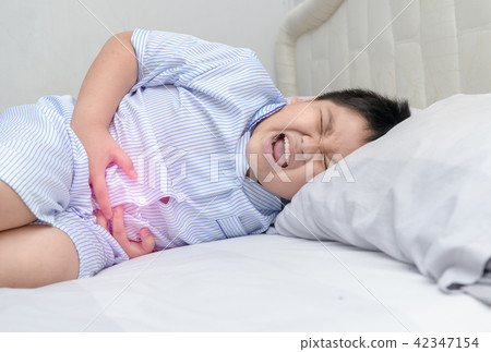 asian fat child suffering from stomachache asian fat child suffering from stomachache 42347154