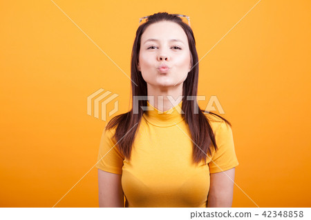 Pretty girl making kiss to the camera Pretty girl making kiss to the camera 42348858