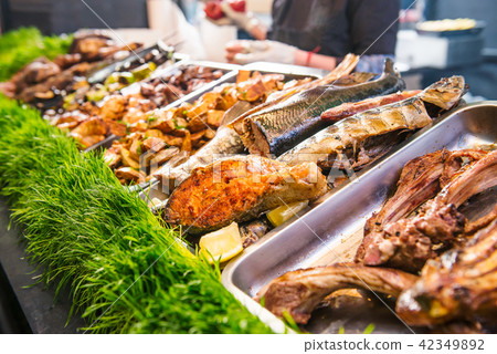 Outdoor Cuisine Culinary Buffet with healthy take away meal - grilled vegetables, fish and meat on Outdoor Cuisine Culinary Buffet with healthy take away meal - grilled vegetables, fish and meat on 42349892