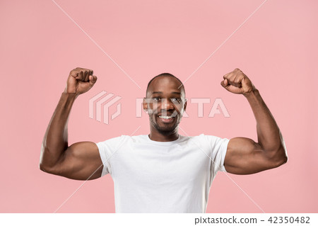 Winning success man happy ecstatic celebrating being a winner. Dynamic energetic image of male model Winning success man happy ecstatic celebrating being a winner. Dynamic energetic image of male model 42350482