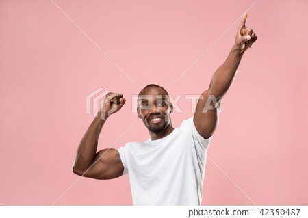 Winning success man happy ecstatic celebrating being a winner. Dynamic energetic image of male model 42350487