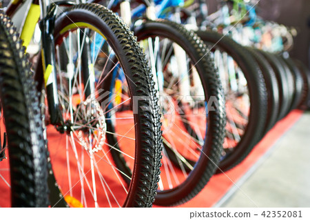 Modern mountain bikes in sports shop Modern mountain bikes in sports shop 42352081