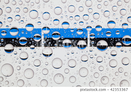 Water drops on glass and flags of Estonia 42353367