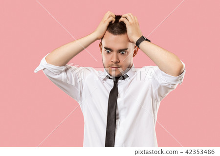 Young emotional surprised, frustrated and bewildered man Young emotional surprised, frustrated and bewildered man 42353486