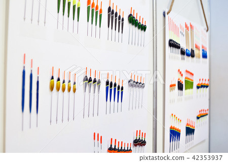 Fishing floats on white wall 42353937