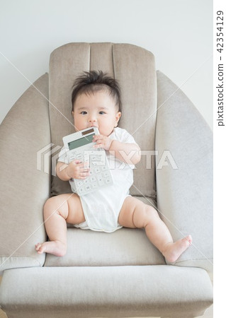 Baby with a calculator 42354129