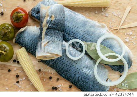 Herring fillet marinated. Cold appetizer. Herring fillet marinated. Cold appetizer. 42354744