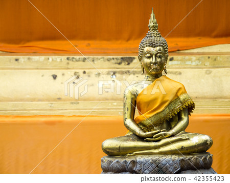 Ancient Golden Buddha in yellow robes Ancient Golden Buddha in yellow robes 42355423