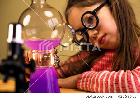 Little Girl Processing Chemical Homework Experiment with Chemical vessels. Child Education Little Girl Processing Chemical Homework Experiment with Chemical vessels. Child Education 42355513