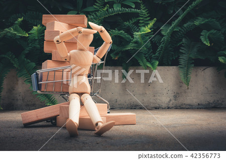 Shopping concept, Mini wooden model is resting Shopping concept, Mini wooden model is resting 42356773