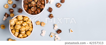 Sweet and salted popcorn on a blue background Sweet and salted popcorn on a blue background 42357313