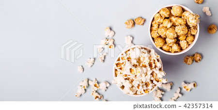 Sweet and salted popcorn on a blue background Sweet and salted popcorn on a blue background 42357314
