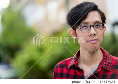 Young Asian man outdoors 42357984