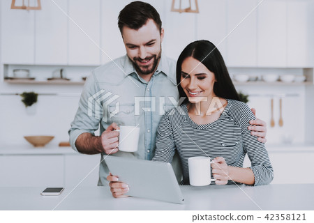 Young Couple Have Breakfast in Morning at Home. Young Couple Have Breakfast in Morning at Home. 42358121