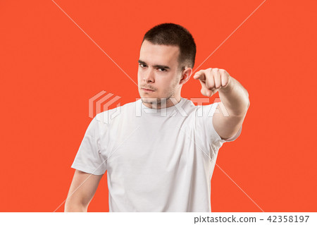 The overbearing businessman point you and want you, half length closeup portrait on orange 42358197