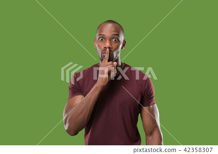 The young man whispering a secret behind her hand The young man whispering a secret behind her hand 42358307