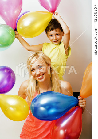 pretty real family with color balloons on white background, blon pretty real family with color balloons on white background, blon 42359257