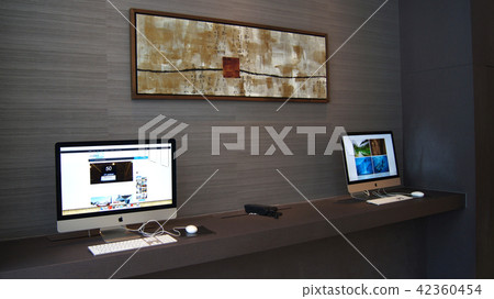 SINGAPORE - APR 2nd 2015: Computer on the table in a Business Center at a luxury hotel 42360454