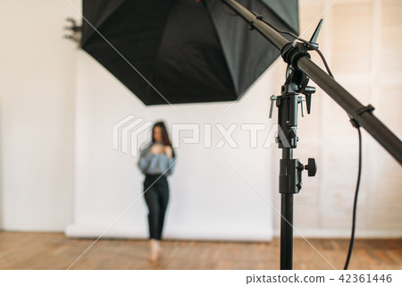 Model poses in photo studio, white background 42361446