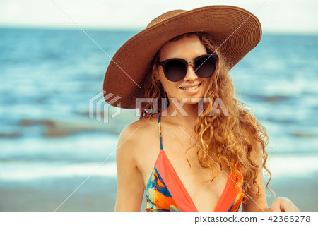 Happy young woman at beach in summer vacation. 42366278