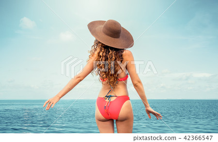 Happy young woman at beach in summer vacation. 42366547