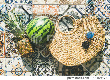 Summer lifestyle background with fruits and straw bag, horizontal composition Summer lifestyle background with fruits and straw bag, horizontal composition 42369375
