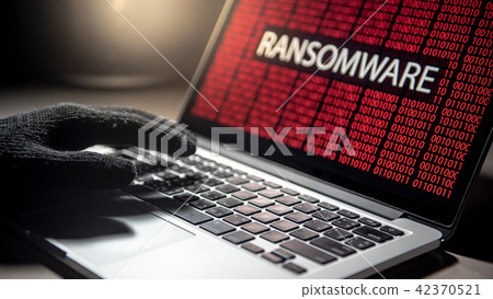 Hacker hand on laptop, ransomware attack screen 42370521