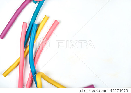 Color hair curlers on a white background with copy space Color hair curlers on a white background with copy space 42371673