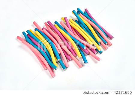 Color hair curlers on a white background with copy space Color hair curlers on a white background with copy space 42371690