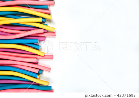 Color hair curlers on a white background with copy space Color hair curlers on a white background with copy space 42371692