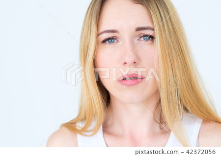 emotion face moody grumpy sullen upset woman 42372056