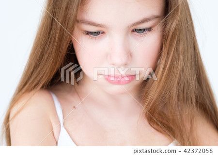 emotion sad hurt offended pursed lips child girl 42372058