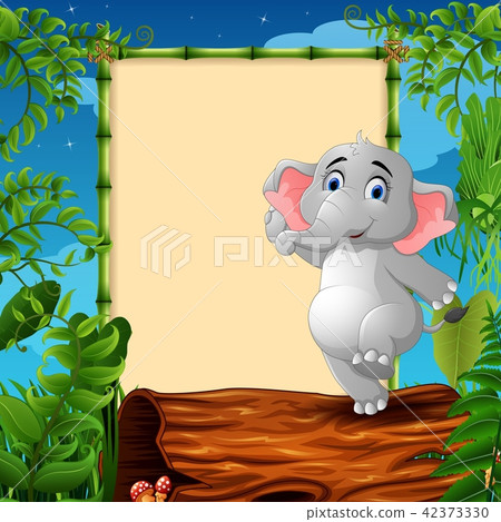 Elephant standing on hollow log near the empty Elephant standing on hollow log near the empty 42373330